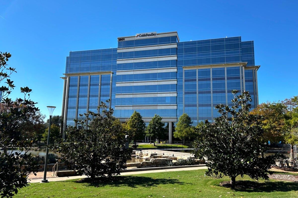 Frisco, Texas Office building - multi story high rise with glass windows and CobbFendley logo