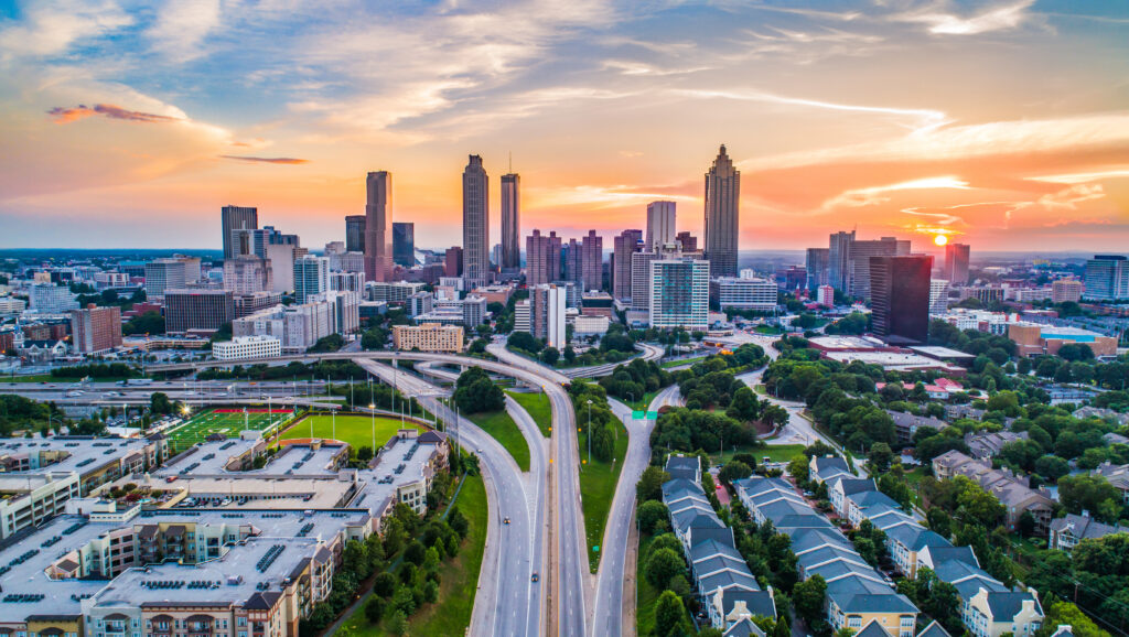 Aerial view of the Atlanta Skyline at sunset and elevated roadways leading into the City