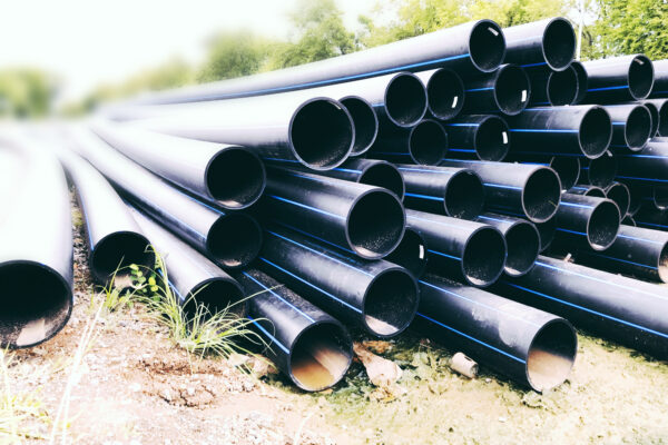 stack of black fiber optic pipes